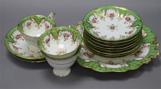 A late Victorian green border floral painted part tea service